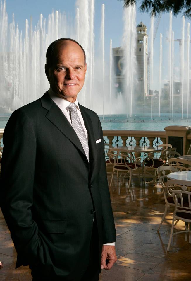 Terry Lanni, former chairman of the board and CEO of then-MGM Mirage, poses at the Bellagio in September 2007. Construction cranes from the CityCenter project can be seen at right.