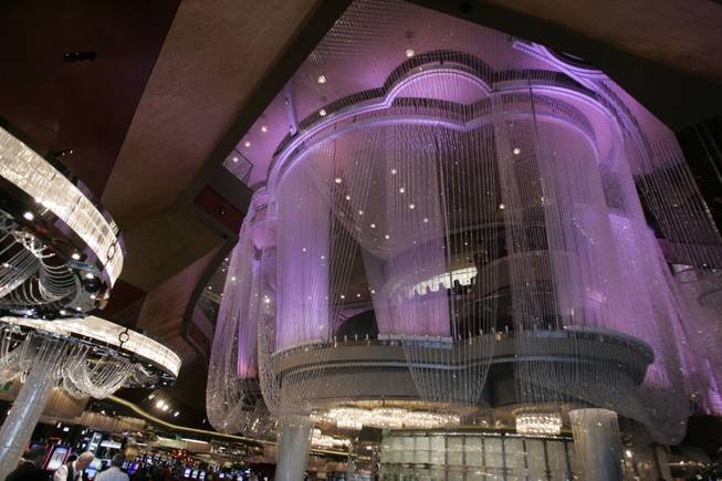 In the center of the casino floor sits Cosmopolitan&#39;s literal crown jewel. The Chandelier is a three-tiered bar and lounge encased by two million crystals dripping in strands from the ceiling almost to the floor, creating the sense of a fantastical, inhabited chandelier. 