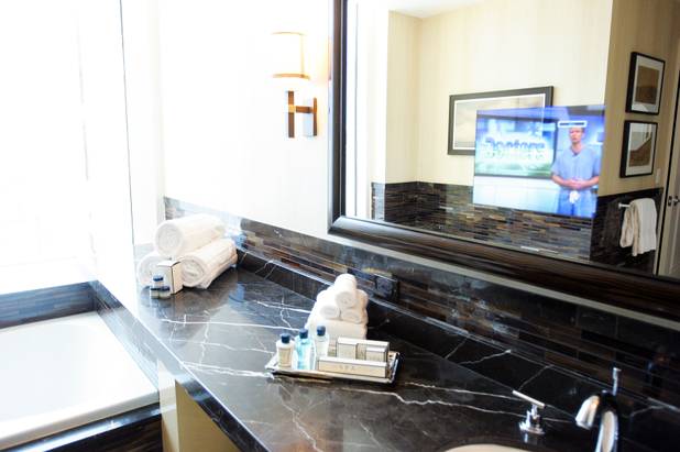 A television inside the mirror in the bathroom of a room at Trump International Hotel Las Vegas Friday, July 8, 2011.