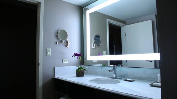 A bright blue bathroom light in an MGM Grand "Stay Well" room is meant to help guests wake up and combat jet lag.