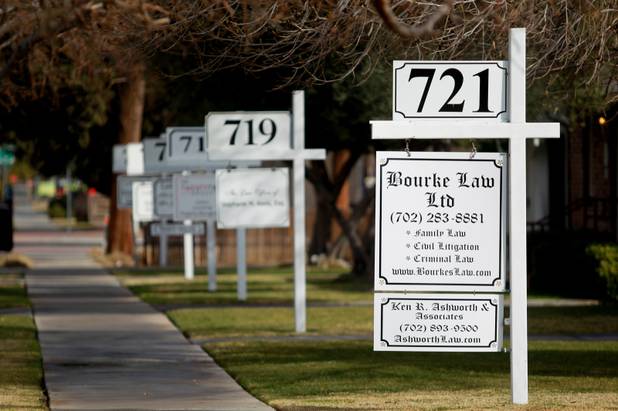 Signs for law offices are seen on 6th Street near downtown Las Vegas on Saturday, Jan. 11, 2014.