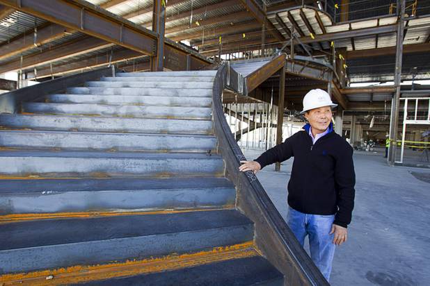 Steven Kwon, president of GKG Builders, talks about the lobby's curved staircases during a tour of the Peace Palace, a Unification Church convention and training center, under construction at 6590 Bermuda Road Monday, April 7, 2014.