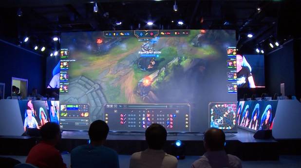Ourgame's e-sports arena in Beijing is a 14,000-square-foot complex featuring hundreds of gaming stations, a 200-seat arena, and a broadcast studio. 
