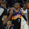 Phoenix Suns guard Chris Paul (3) and Dallas Mavericks forward Reggie Bullock, right, react after Paul was called for a foul during the first half of Game 2 Wednesday, May 4, 2022, in Phoenix. 


