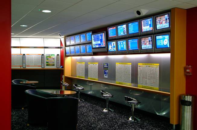 A look inside a William Hill betting shop. The British company, known for offering better odds and taking bigger bets than Las Vegas books, is buying American Wagering Inc., which operates Leroy's sports books.