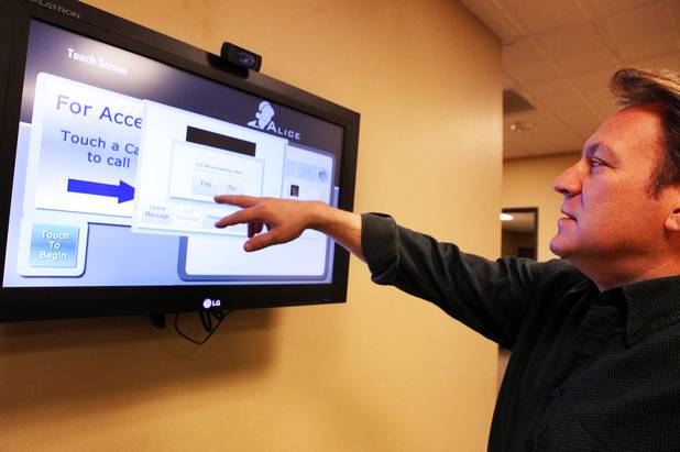 Frank Yoder, the president of WinTech, demonstrates ALICE, an automated reception system developed by the Las Vegas-based  software company, inside the reception area of the WinTech offices on Thursday, March 29, 2012.