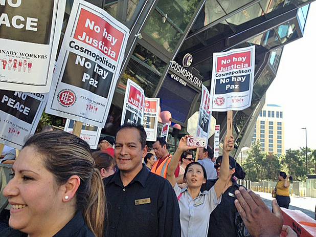 Workers picket outside Cosmopolitan over the lack of a union contract, Friday, June 14, 2013.