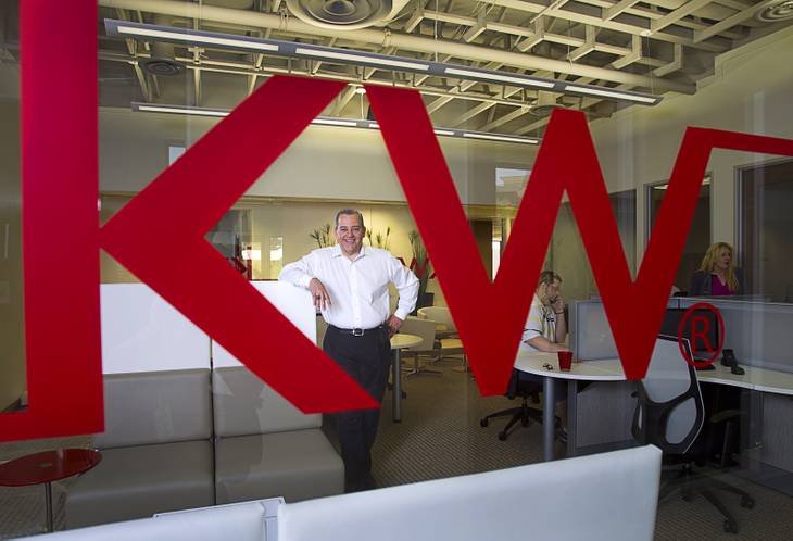 Jaime Velez, broker and operating partner, poses in the "Bull Pen," an Internet lounge and workstation, at the Keller Williams Southern Nevada new offices Thursday, April 24, 2014. The lounge also provides computers with wired connections for brokers that don't have a laptop. The office celebrated their grand opening Wednesday (April 30).