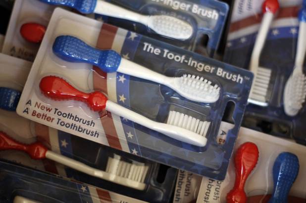 Steven Walther packs orders for his Toof-inger Brush, designed to be held by two fingers, in Apex, N.C., on April 20, 2014. Walther came up with the concept for his brush while serving as a Green Beret in Afghanistan.