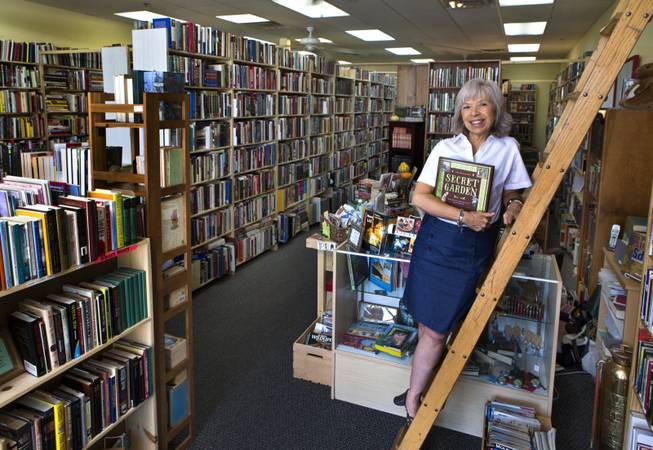 Kim Henry opened BooksOrBooks this year. She placed a cart in the front of the store where young readers can take a book free of charge. 