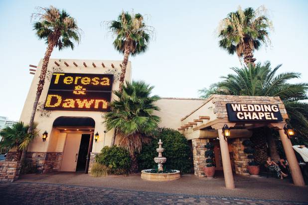 The Viva Las Vegas Wedding Chapel celebrates the marriage of Teresa Jo Gifford and Dawn Ellen Wise on its marquee. 